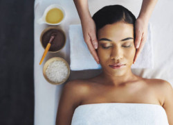 Shot of an attractive young woman getting a massage at a spa
